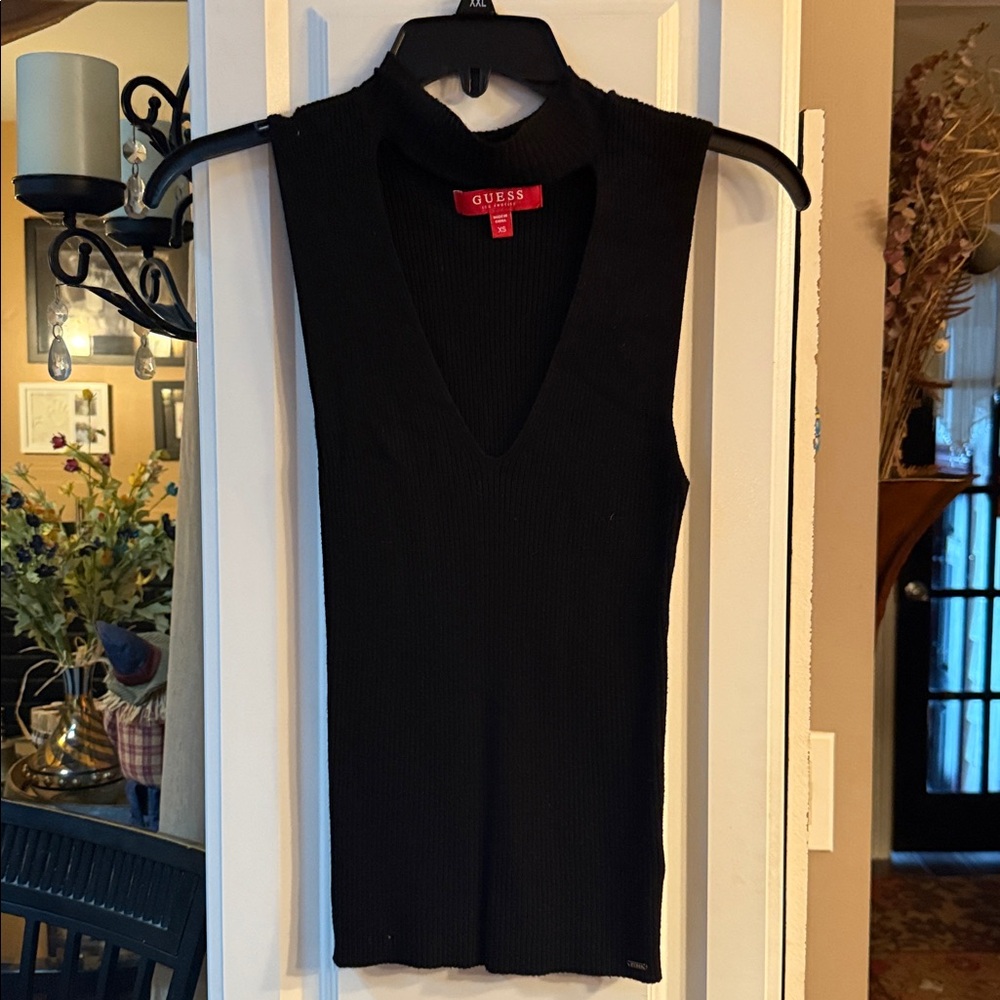 Guess Black V-Neck Sleeveless Top
NWOT
More like a small/Med